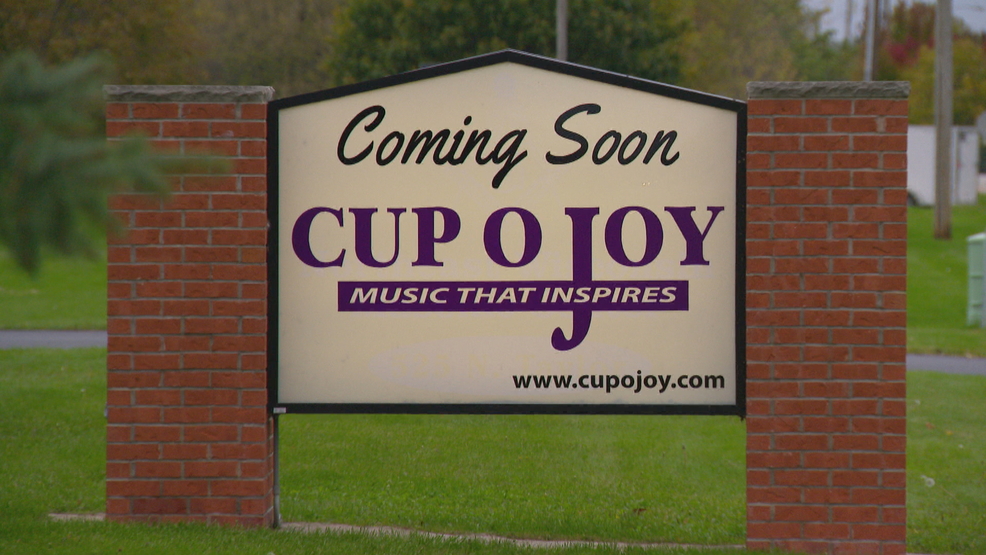 Reaching for a bigger cup, Cup O Joy leaving downtown Green Bay after